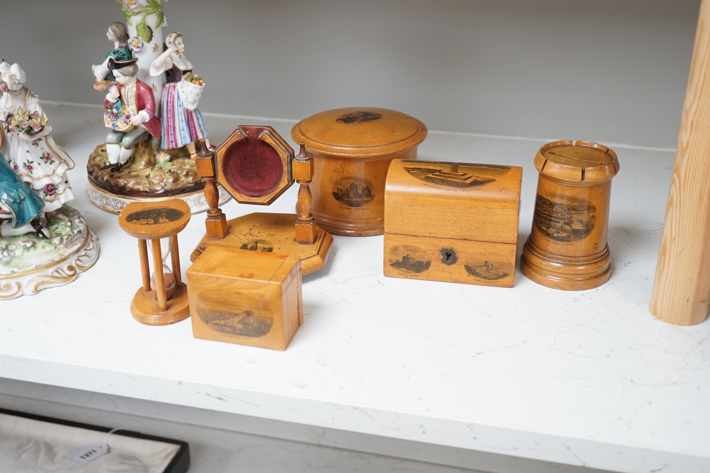 Sixteen mixed Mauchline ware boxes, pin cushions, pots, and a frame etc, tallest 13.5cm high